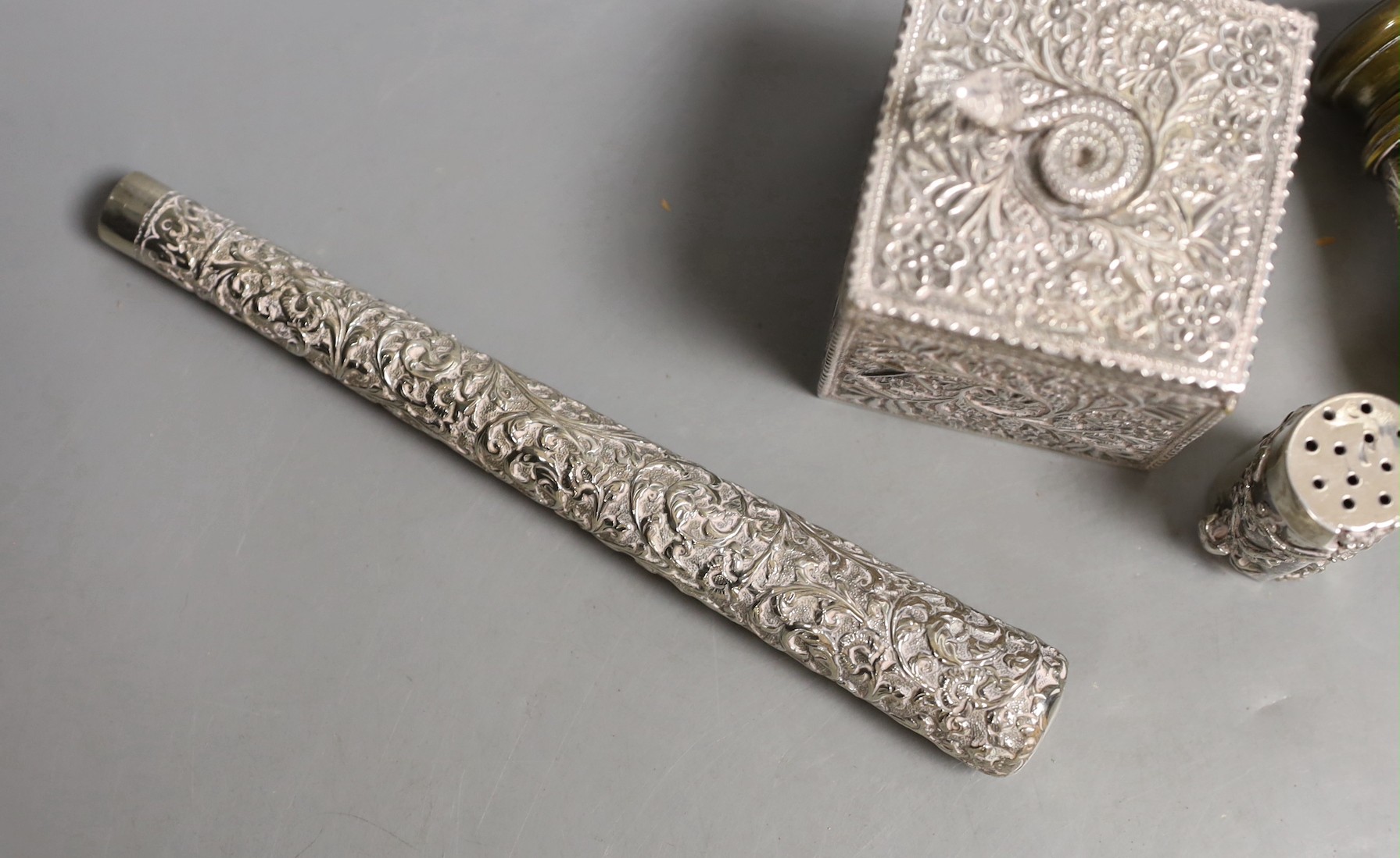 A late Victorian Indian silver box and cover, with serpent finial, import marks for London, 1898, 9cm, a Chinese Export white metal condiment, a pair of late Victorian silver mounted opera glasses and a white metal paras